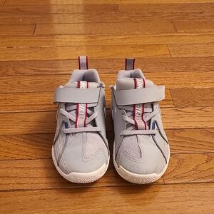 Nike Kids Sneakers in Gray with Red and Blue Accents